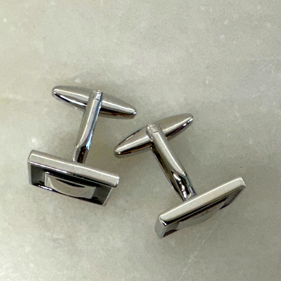 Silver and black enamel cufflinks.